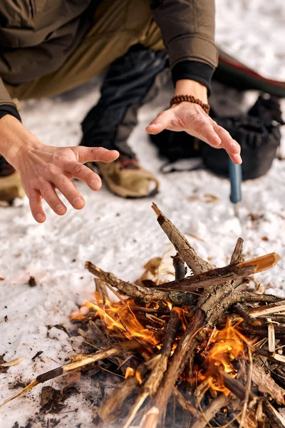 Cropped Man Warm Hands Fire Sit Next Fire Travel Concept — Stockfoto