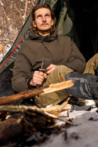 Calm Handsome Man Sit Cutting Wood Knife Next Tent Camping — Foto Stock