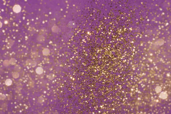 Kumaş üzerine altın glitter parçacıklar — Stok fotoğraf