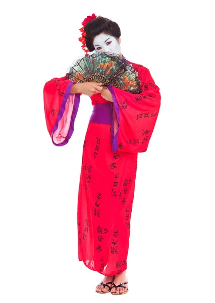 Full length portrait of geisha hiding behind fans isolated on wh — Stock Photo, Image
