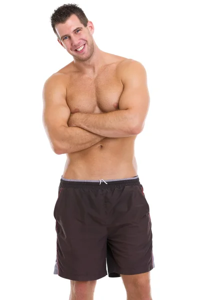 Portrait of healthy muscular guy in shorts — Stock Photo, Image