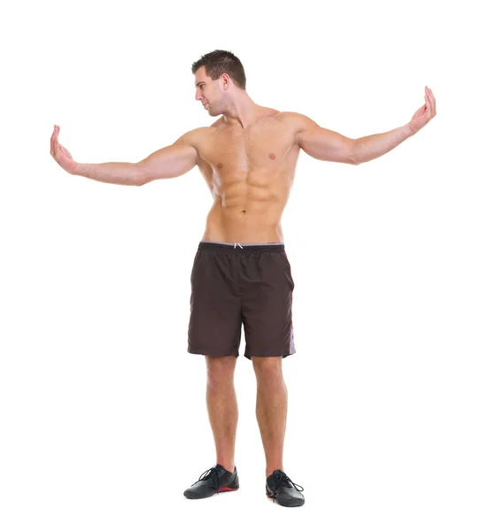 Healthy man showing muscular body — Stock Photo, Image