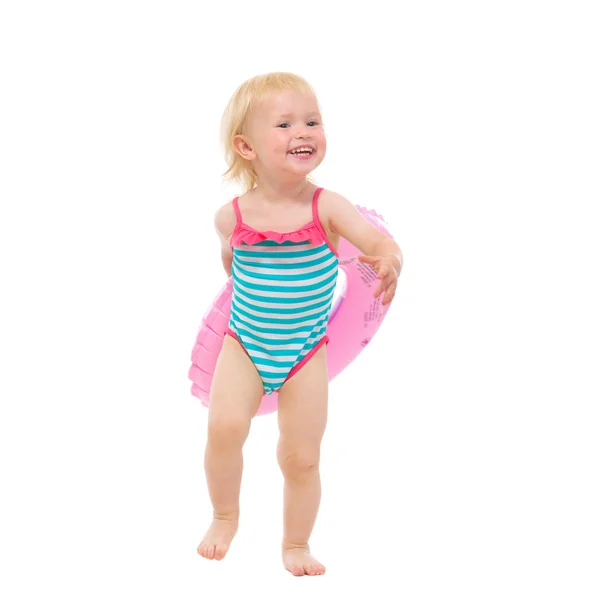 Smiling baby in swimsuit with inflatable ring — Stock Photo, Image