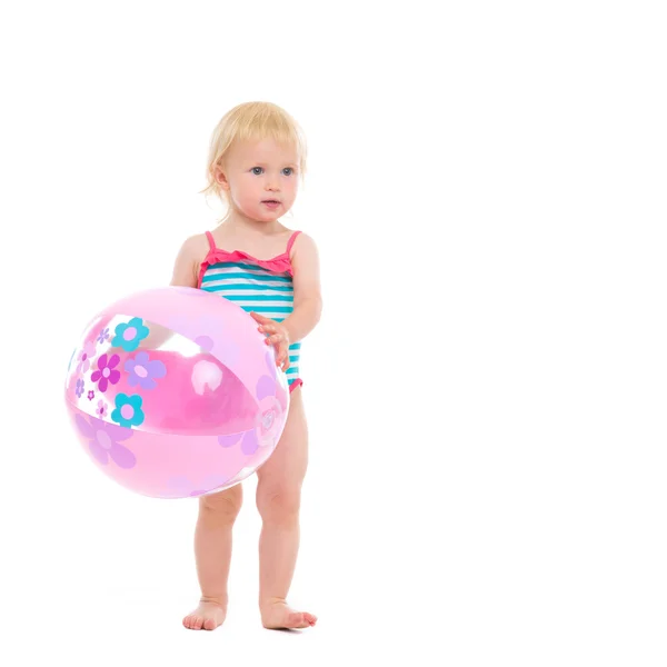 Baby in swimsuit with inflatable beach ball — Stock Photo, Image