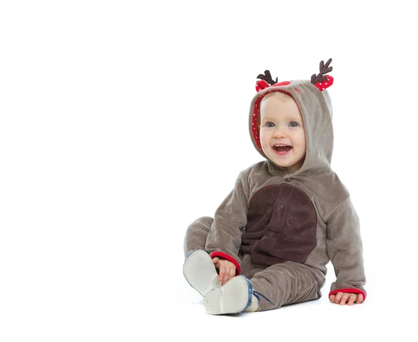 Χαμογελώντας μωρό στο κοστούμι Χριστουγέννων κοιτάζοντας στο διάστημα αντίγραφο — Φωτογραφία Αρχείου
