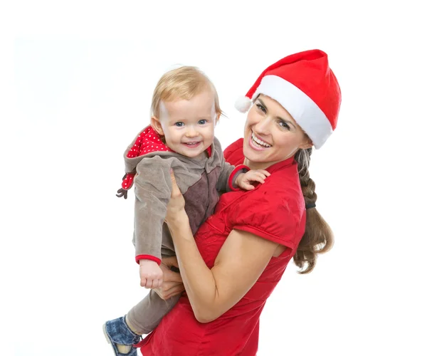 Portrait de mère dans le chapeau du Père Noël jouant avec bébé — Photo