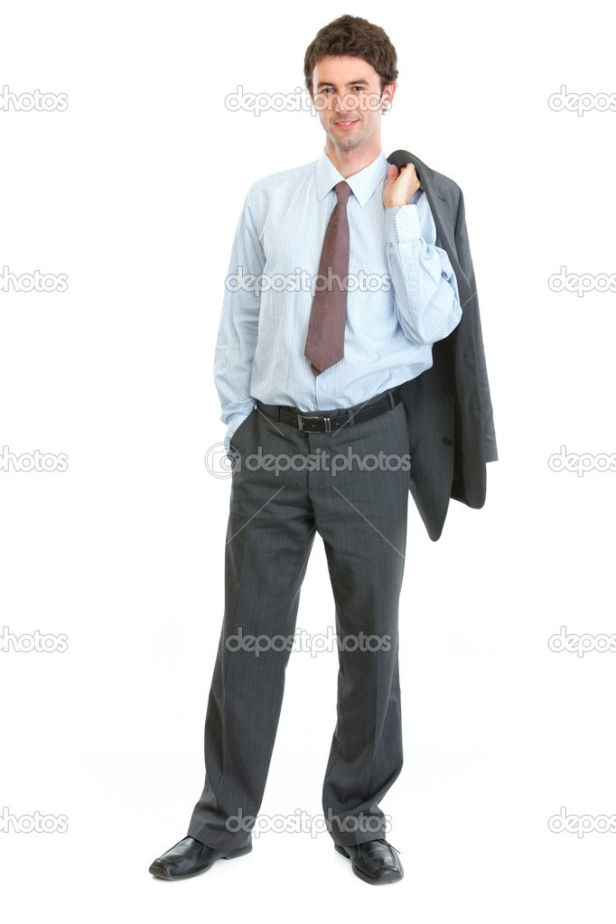 Full length portrait of happy businessman with jacket on shoulde