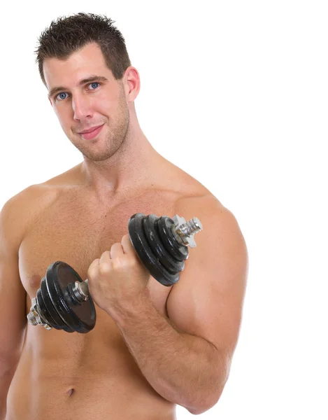 Homem muscular feliz levantando halteres — Fotografia de Stock