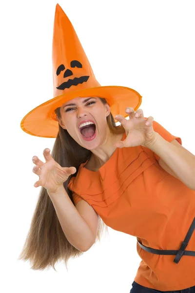 Woman in Halloween hat making scaring pose Stock Picture