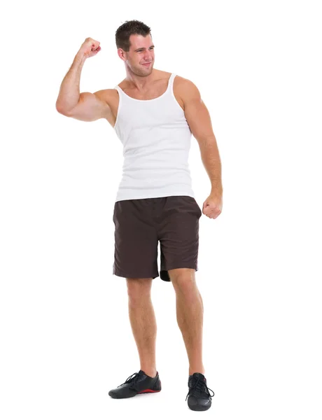 Happy muscular man rejoicing success — Stock Photo, Image