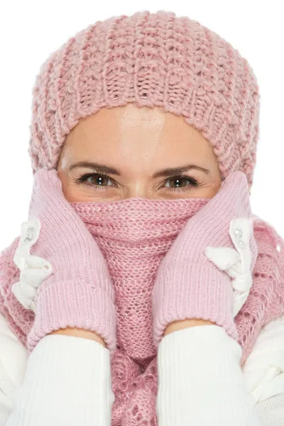 Woman in knit winter clothing closing face with scarf — Stock Photo, Image