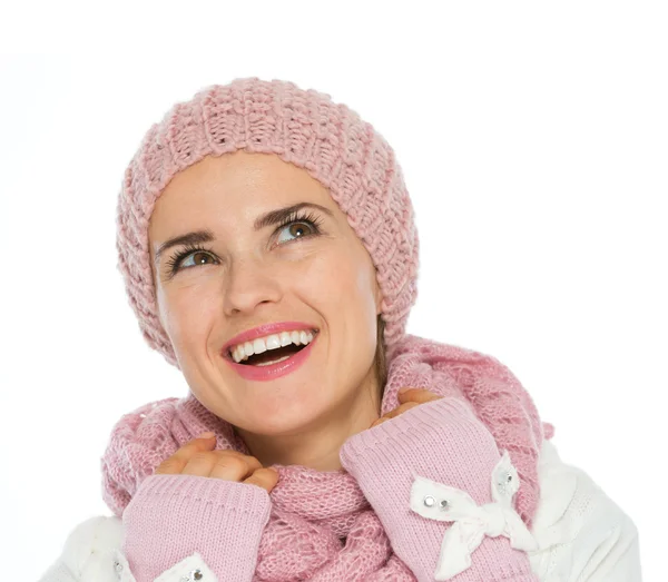 Smiling woman in knit winter clothing looking up on copy space — Stock Photo, Image