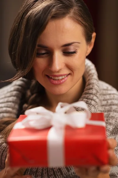 Happy young woman holding Christmas present box Stock Picture