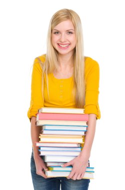 yığın kitap tutan mutlu öğrenci kız