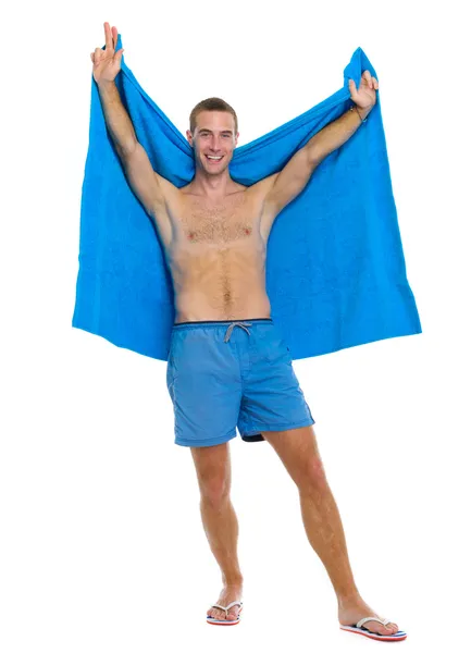 Full length portrait of happy young man with towel — Stock Photo, Image