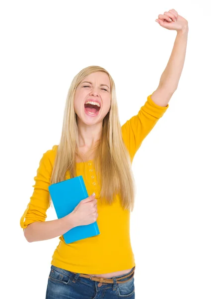 Menina estudante feliz com livro regozijando sucesso — Fotografia de Stock