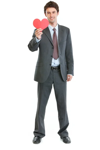 Hombre moderno en traje de negocios con corazón de papel — Foto de Stock