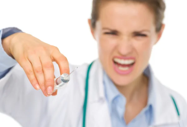Closeup on syringe in hands of frightening medical doctor — Stock Photo, Image