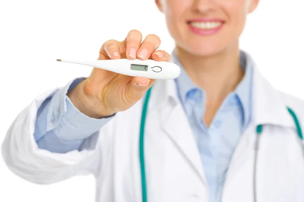 Closeup on thermometer in hands of smiling medical doctor — Stock Photo, Image