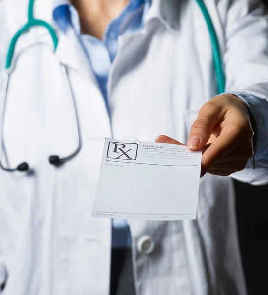 Closeup on medical doctor woman giving prescription isolated — Stock Photo, Image