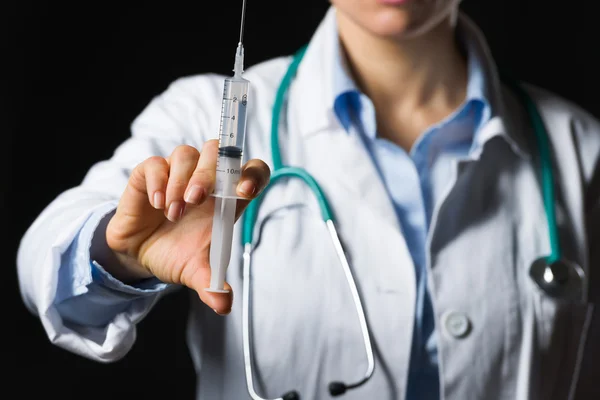 Closeup on syringe in hand of medical doctor woman — Stock Photo, Image