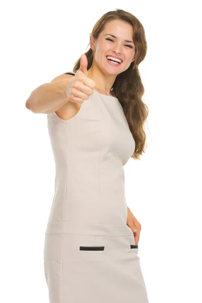 Young woman in dress showing thumbs up — Stock Photo, Image