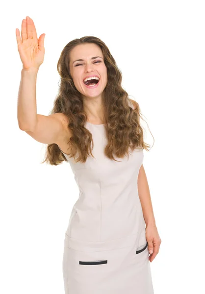 Smiling young woman in dress saluting — Stock Photo, Image