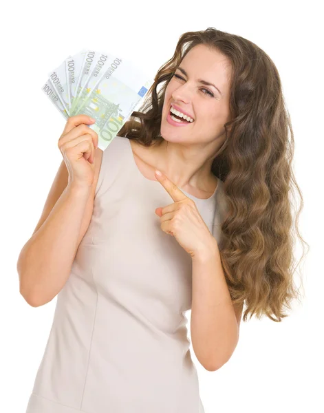 Young woman giving fun of euro banknotes — Stock Photo, Image