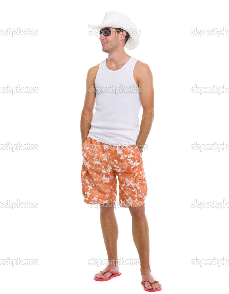 Full length portrait of happy young man looking on copy space