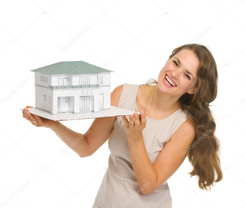 Woman landlord with scale model of house