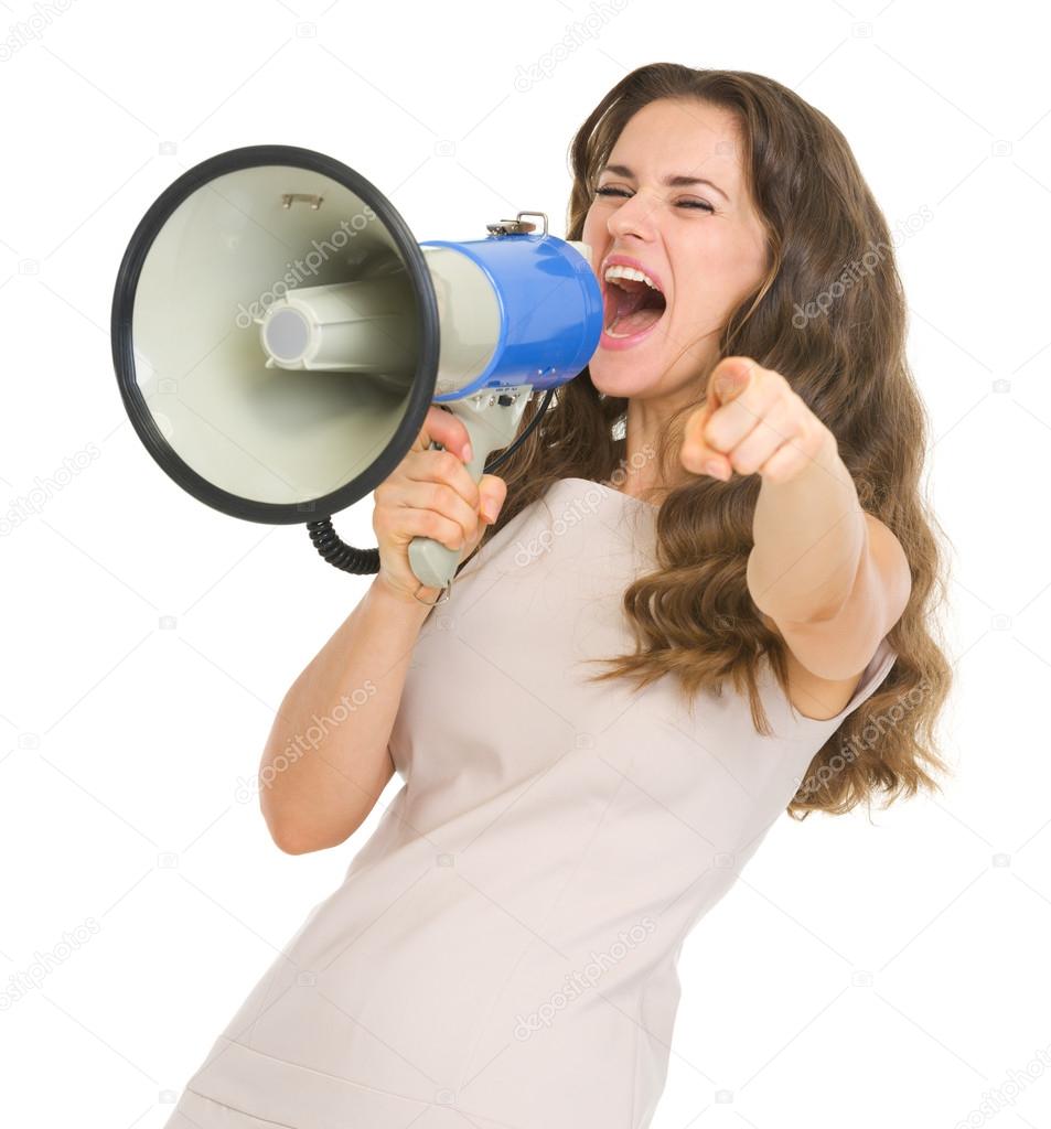 Young woman shouting in megaphone