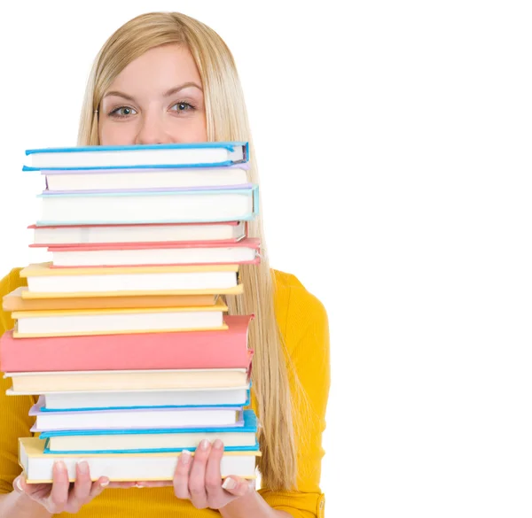 Estudante menina segurando pilha de livros — Fotografia de Stock