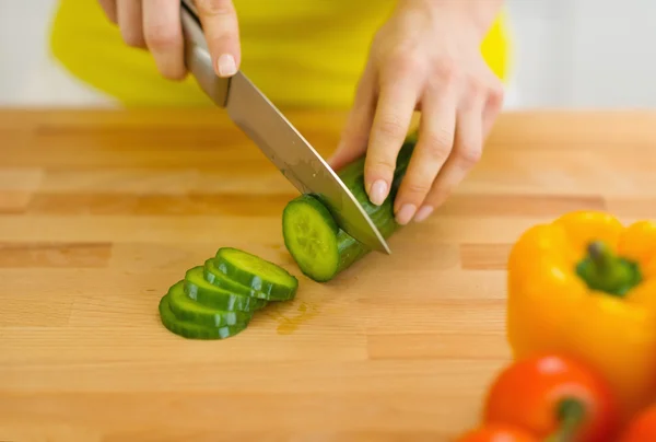 Closeup on housewife cutting cucumber — Stock Photo, Image