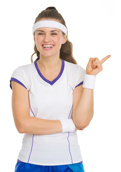 Happy tennis player pointing on copy space — Stock Photo, Image