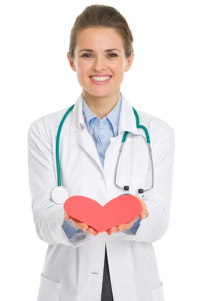 Closeup on medical doctor woman giving paper heart — Stock Photo, Image