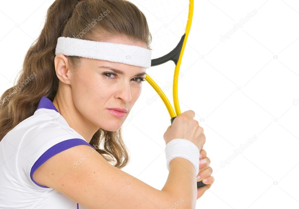 Confident tennis player ready to hit ball