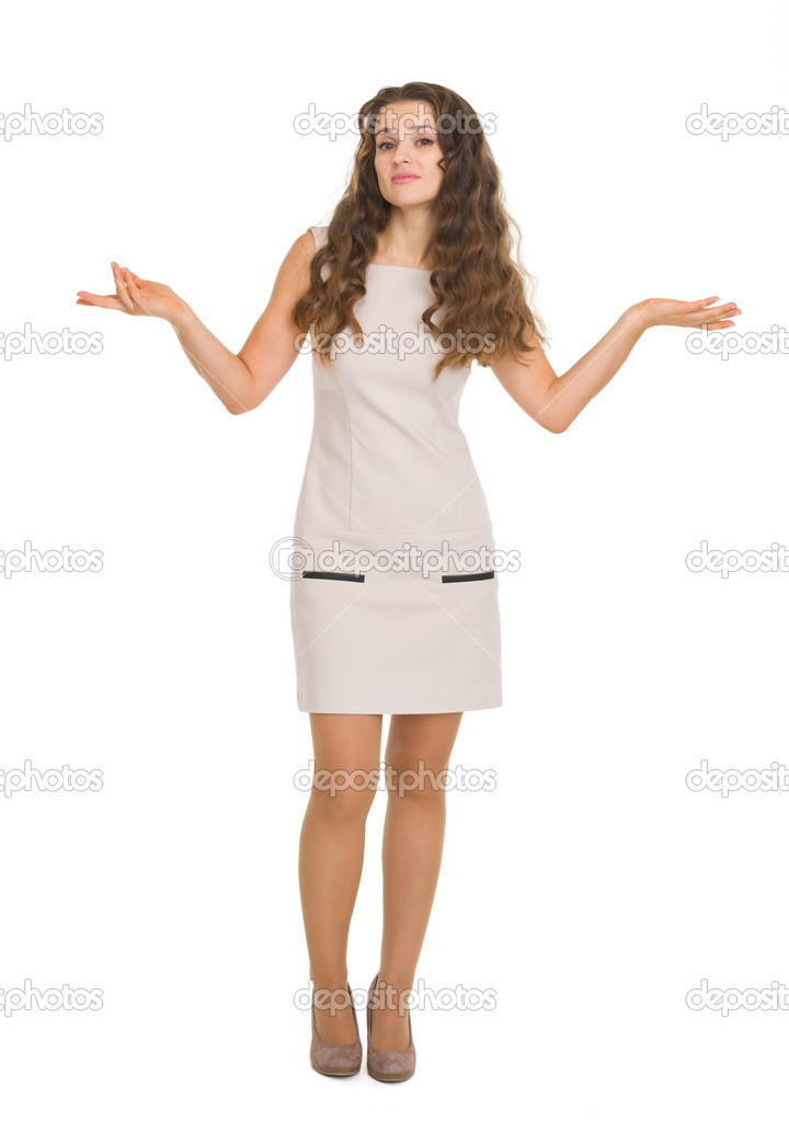 Full length portrait of clueless young woman shrugs
