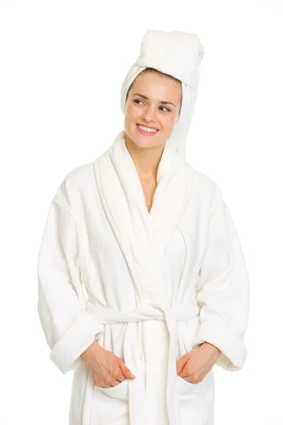 Young woman in bathrobe looking on copy space Stock Photo