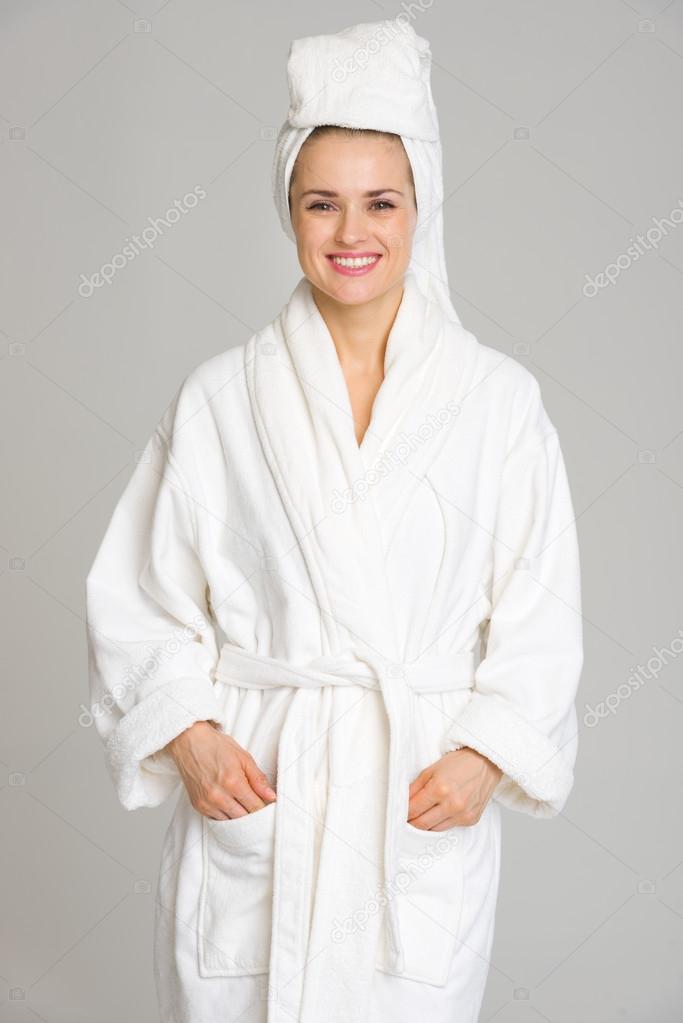 Portrait of happy young woman in bathrobe