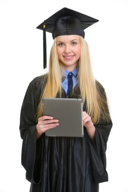tablet pc kullanma mezuniyet elbise genç gülümseyen