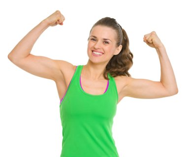 Happy fitness young woman showing biceps clipart