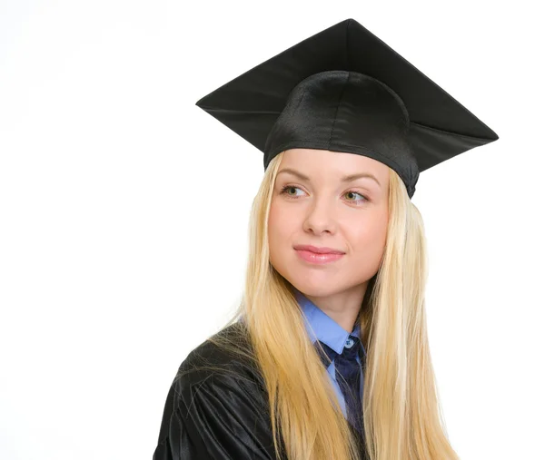 Mujer joven feliz en vestido de graduación en busca de espacio de copia — Foto de Stock
