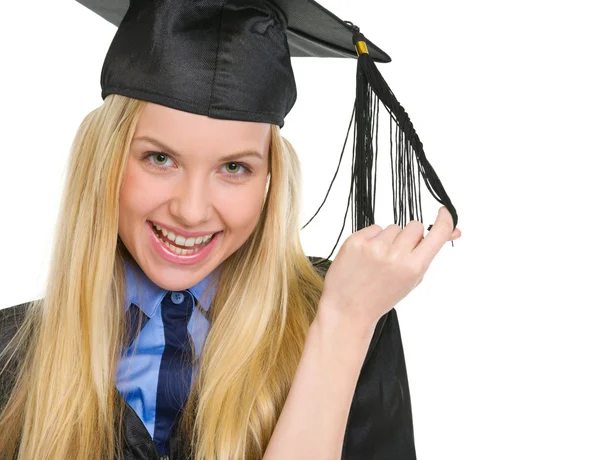 Portrait of happy young woman in graduation gown — Stock Photo, Image