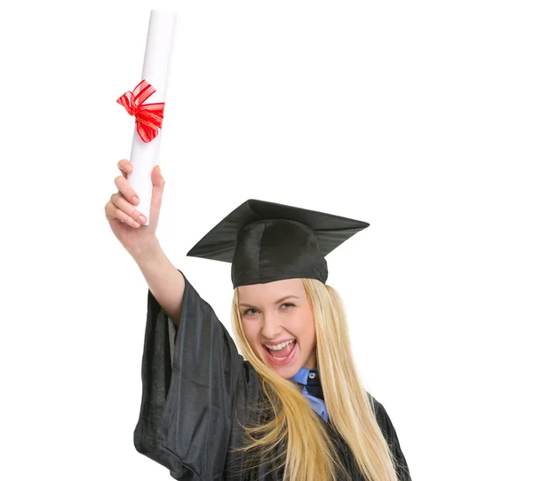 Glad ung kvinna i gradering klänning med diplom glädjens succ — Stockfoto
