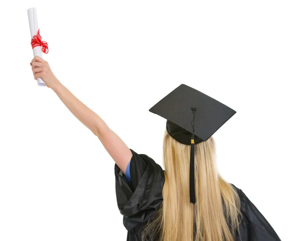 Woman in graduation gown with diploma rejoicing success . rear v — Stock Photo, Image