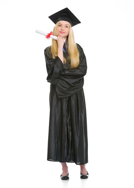 Full length portrait of young woman in graduation gown with dipl — Stock Photo, Image