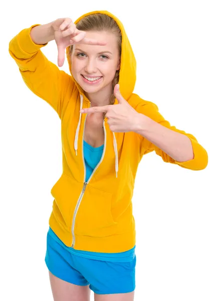 Smiling teenager girl framing with hands — Stock Photo, Image