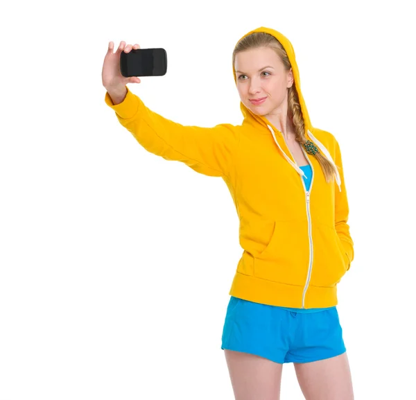 Gelukkig tiener meisje nemen foto met mobiele telefoon — Stockfoto