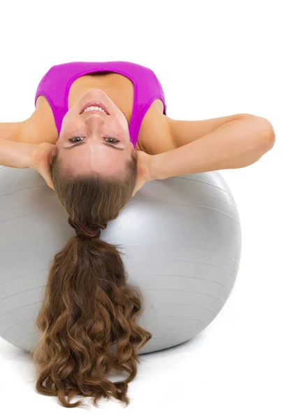 Happy fitness young woman doing abdominal crunch on fitness ball — Stock Photo, Image