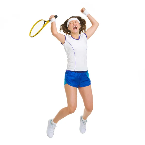 Happy female tennis player jumping — Stock Photo, Image